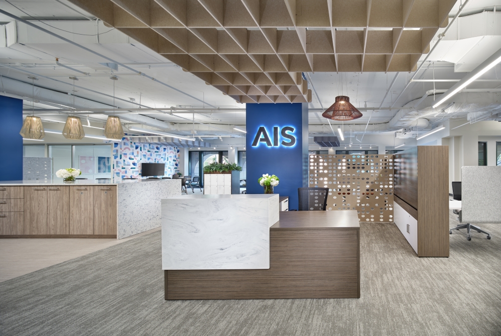 Calibrate Reception with Corner Stack in Corian Carrara Lino